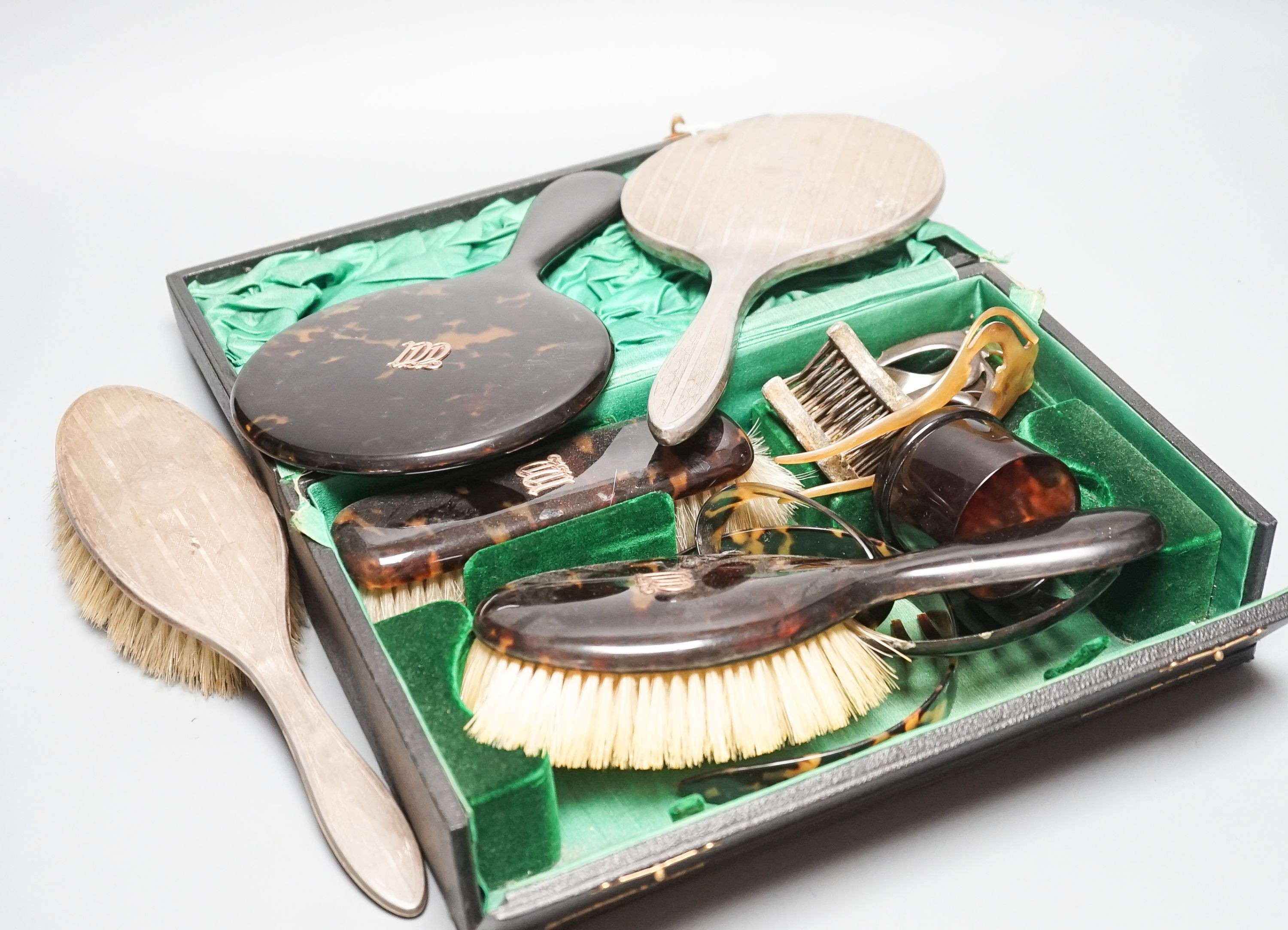 A tortoiseshell toilet set and silver dressing table items